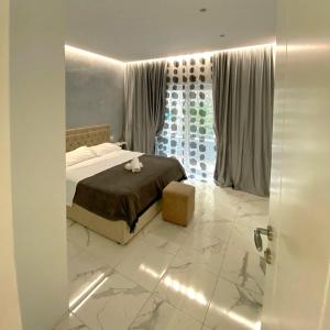 Ένα ή περισσότερα κρεβάτια σε δωμάτιο στο Beni 's apartments