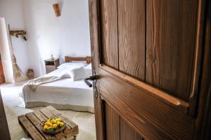 Postel nebo postele na pokoji v ubytování Masseria Uccio