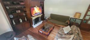 an overhead view of a living room with a television at Casa Luisín Jacuzzi exterior Casa completa 10 personas in El Pino