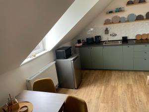 a kitchen with a sink and a counter at Apartment Drahuska in Prague