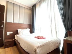 Ένα ή περισσότερα κρεβάτια σε δωμάτιο στο The Astra Condo 2bedrooms apartment +13 φωτογραφίες