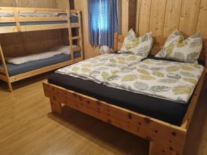 Postel nebo postele na pokoji v ubytování Ferienchalet Murau Blick + 5 fotografií