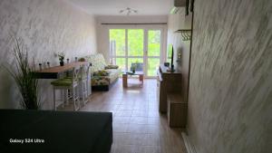 a living room with a couch and a table at Студио за гости Перла in Belogradchik