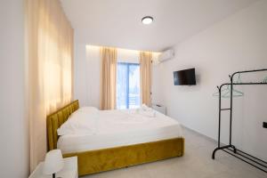 Postel nebo postele na pokoji v ubytování Sunset Aparthotel