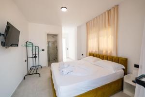 Postel nebo postele na pokoji v ubytování Sunset Aparthotel