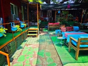 a patio with a table and chairs and a table and chairs at Side Tuana Garden Home in Side