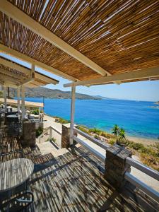 a patio with a view of the ocean at Alezina studios in Amorgos +40 photos