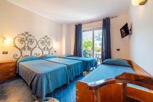 Postel nebo postele na pokoji v ubytování Hotel Terme Don Pepe + 37 fotografií