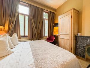 Postel nebo postele na pokoji v ubytování Hotel Botaniek