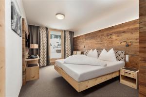 Łóżko lub łóżka w pokoju w obiekcie Hotel Nassereinerhof