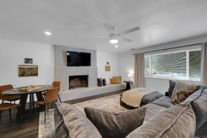 a living room with a couch and a fireplace at A Cozy Home | Games | Dogs OK in Yuba City