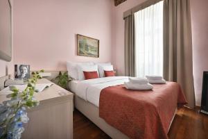 Postel nebo postele na pokoji v ubytování Boutique Residence by Little King