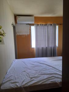 En eller flere senge i et værelse på APT COP 30 Residencial Itaoca Ananindeua + 12 billeder