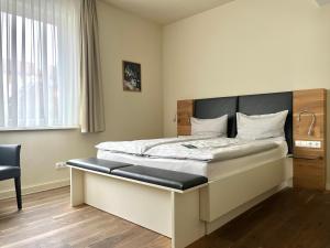 Voodi või voodid majutusasutuse Gasthaus Zur Noll toas