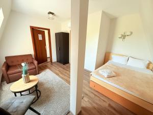 Postel nebo postele na pokoji v ubytování Vėjukai