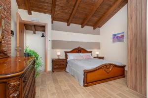 Ένα ή περισσότερα κρεβάτια σε δωμάτιο στο Viverone Lake - La Borgata Guesthouse x12