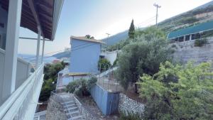 a house with a staircase leading up to a building at Ponti Beach Hotel in Vasiliki