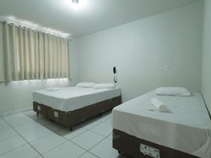 Postel nebo postele na pokoji v ubytování Hotel Colina