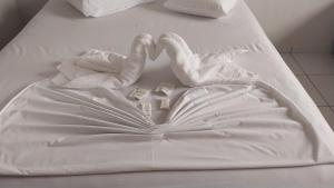 Postel nebo postele na pokoji v ubytování Hotel Colina