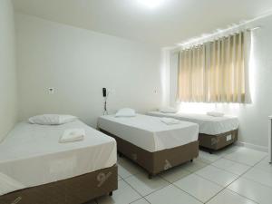 Postel nebo postele na pokoji v ubytování Hotel Colina