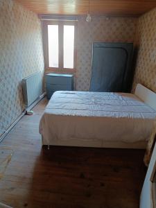 Postel nebo postele na pokoji v ubytování Maison Ancienne Albies