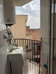 a balcony with a view of a building at Apartamento terramarzarron in Mazarrón