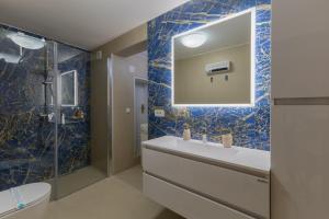 a bathroom with a sink and a mirror at Apartments Ljubica in Poreč +30 photos