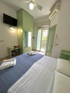Postel nebo postele na pokoji v ubytování Hotel Caracas
