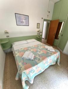 Postel nebo postele na pokoji v ubytování Hotel Caracas