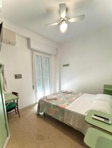 Postel nebo postele na pokoji v ubytování Hotel Caracas
