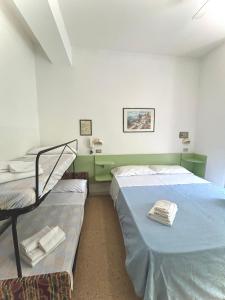 Postel nebo postele na pokoji v ubytování Hotel Caracas