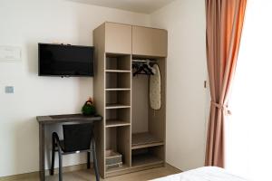 Televízia a/alebo spoločenská miestnosť v ubytovaní Apartments Jurišević