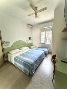Postel nebo postele na pokoji v ubytování Hotel Caracas