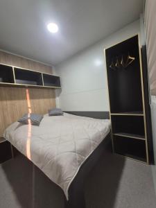 a bedroom with a large bed in a room at Doris in Pakoštane