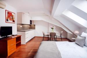 TV a/nebo společenská místnost v ubytování Anděl Apartments Praha