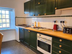 Kuchyň nebo kuchyňský kout v ubytování Quay Cottage