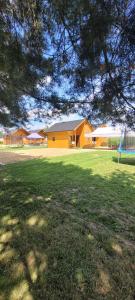 a large yard with a house and a playground at Noclegi u Eli Zator Energylandia in Zator