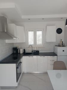 Kuchyňa alebo kuchynka v ubytovaní Apartman Mandi