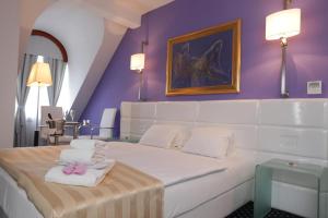 Postel nebo postele na pokoji v ubytování Hotel Phoenix