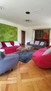 a living room with two couches and a table at Swiss Art & Vine Pop-Up House in Biel