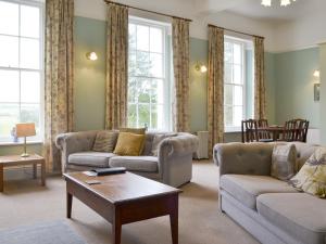a living room with two couches and a table at Apartment 3-Uk33247 in Grayrigg