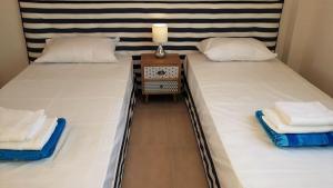 Ένα ή περισσότερα κρεβάτια σε δωμάτιο στο Villa Thalassa