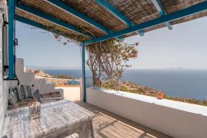 a view of the ocean from the balcony of a house at Mesaria Home in Donoussa