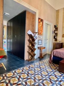 Posteľ alebo postele v izbe v ubytovaní Palazzo Zappata luxury room Noto centro