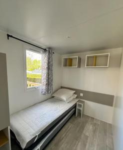 Ένα ή περισσότερα κρεβάτια σε δωμάτιο στο Bungalow, 3 chambres