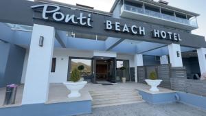 a beach hotel with a sign that reads tourist beach hotel at Ponti Beach Hotel in Vasiliki