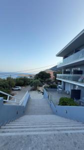 a stairway leading up to a building on the beach at Ponti Beach Hotel in Vasiliki