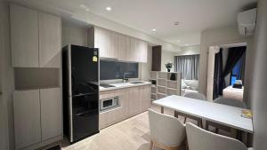 Η κουζίνα ή μικρή κουζίνα στο Paradise condo-perfect location