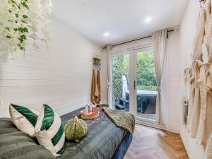 a room with a bed with pillows and a table at Retreat - Uk48163 in Battle