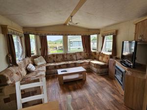 Χώρος καθιστικού στο Honey Cottage Caravan Park
